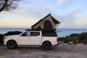 Smart ute storage setup ideas for touring with a ute tub or truck bed. The storage ideas of the canopy maximise space. swift 1400 ironman rooftop tent