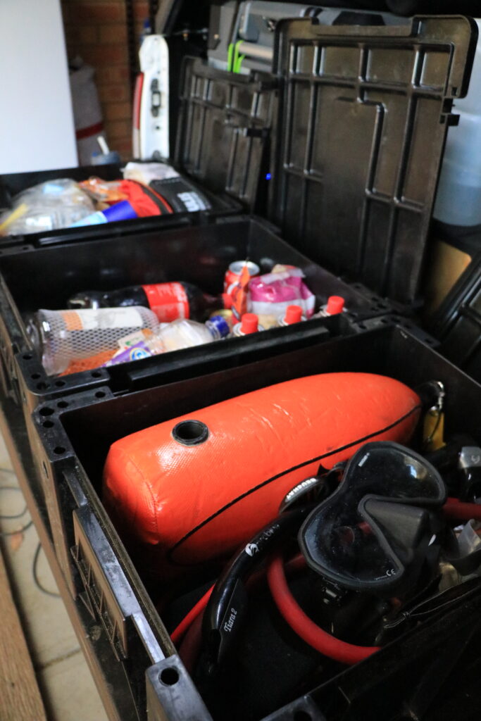 dual cab ute tub canopy storage setup ideas for touring with a truck bed. Ammo box storage solutions for dive gear while touring. 