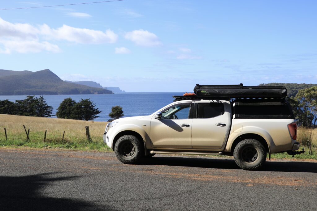 Roof top tent touring with a dual cab ute tub canopy setup or truck bed.  ironman hardshell swift 1400 with deltawing. 