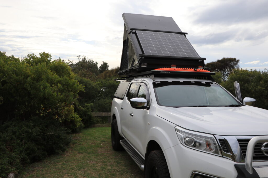 Roof top tent touring with a ute tub or truck bed. The idea to fitout with a camping layout and plan, to make this the ultimate touring canopy, ute camping setup. ironman hardshell swift 1400 with deltawing. maxtrax mount rhino rack. dual cab tub canopy setup